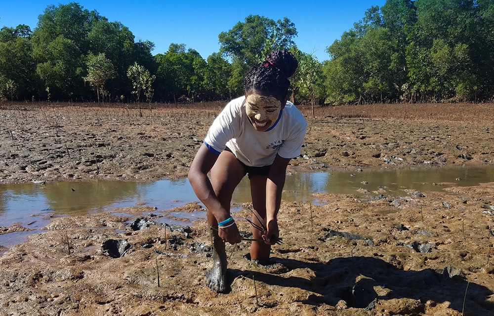 girl tree planting in Madagascar